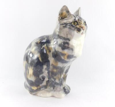 A Winstanley pottery tabby cat, modelled in seated pose with glass eyes, painted mark, 31cm high.