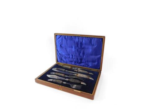 A Victorian Scottish horn and silver plated carving set, by George D Rattray of Dundee, comprising steel, two graduated knives and forks and a fish knife and fork, mahogany cased, 47cm wide, 32cm deep.