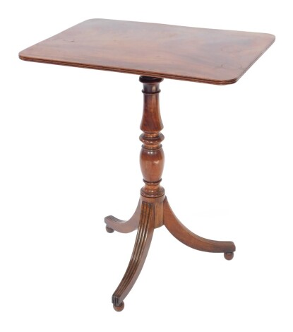 A George III mahogany tripod table, with rectangular mounded top, turned pillar and three reeded legs, 60cm high, 45cm wide.