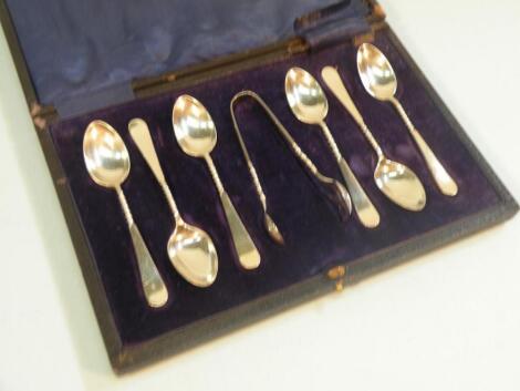 A set of six silver teaspoons each with a part spirally twisted handle