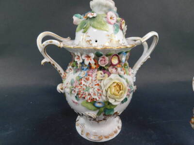 A garniture of three Derby style pot pourri vases, with rose covers and floral encrusted bodies, 22cm high, and 17cm high. - 2