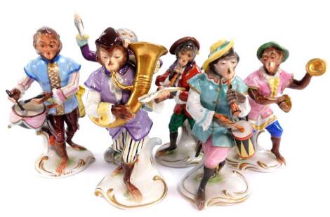 A Volkstedt porcelain monkey band, comprising six figures including the conductor, each 15cm high.