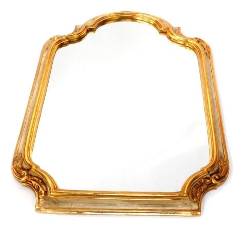 A cream and gilt wood serpentine topped wall mirror, with leaf decoration, 100.5cm high, 66cm wide.