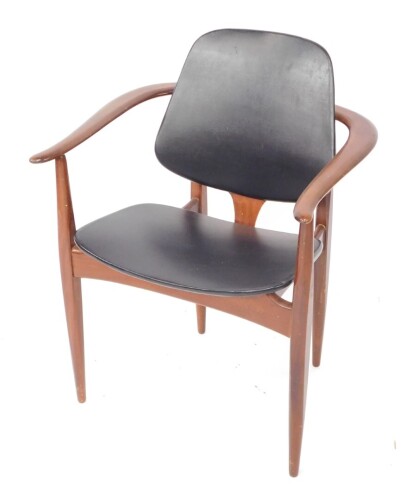 An Elliotts of Newbury (EON) mid century teak carver chair, upholstered in black vinyl.