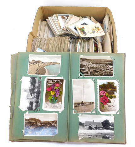 Deltiology. Topographical and sentimental postcards, ocean liners., theatre stars., humorous and greeting cards, in an album and loose. (a quantity)