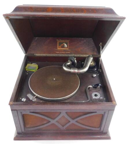 An HMV oak cased table top gramophone, 33cm high, 44.5cm wide, 38cm deep.