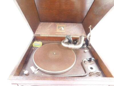 An HMV oak cased table top gramophone, 33cm high, 44.5cm wide, 38cm deep. - 2