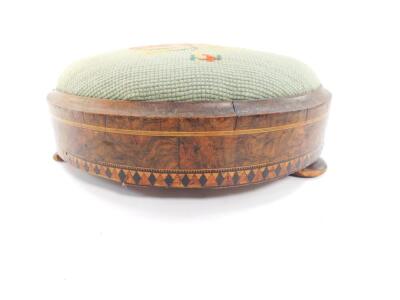 A Victorian walnut and inlaid foot stool, with floral wool work tapestry, raised on three bun feet, 27cm diameter. - 2