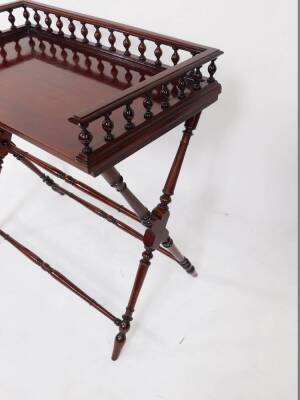 A mahogany butler's tray top table, with a three sided gallery raised on X frame supports, united by turned stretchers, 85cm high, 82cm wide, 47.5cm deep. - 3