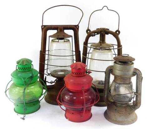 Five various hurricane lamps.