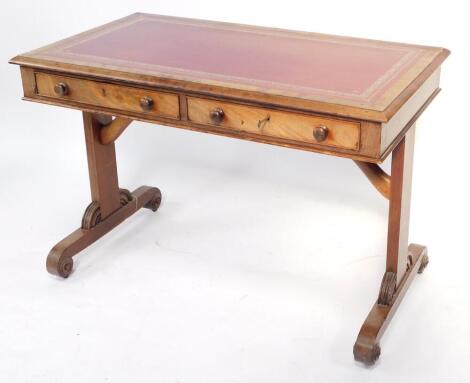 A William IV mahogany library table, with a later red seam inset top, over a pair of frieze drawers, raised on square and turned end supports, 73cm high, 106cm wide, 60.5cm deeep.