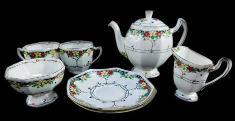 A Royal Doulton porcelain tete a tete decorated in the Arvon pattern, printed and painted marks, comprising teapot, cream jug, sugar bowl, two cups and saucers.