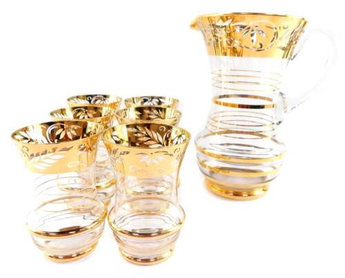 A 1950's cut glass and gold resist water set, decorated with a band of flowers and leaves, comprising water jug and six glasses.