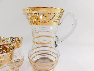 A 1950's cut glass and gold resist water set, decorated with a band of flowers and leaves, comprising water jug and six glasses. - 2