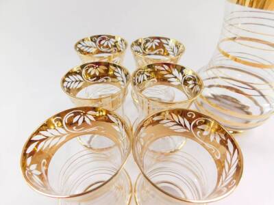 A 1950's cut glass and gold resist water set, decorated with a band of flowers and leaves, comprising water jug and six glasses. - 3