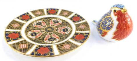 A Royal Crown Derby porcelain tea plate decorated in the Old Imari pattern, number 1128, together with an imari paperweight modelled as a robin. (2)