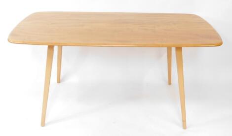 An Ercol light elm and ash plank topped dining table, design by Luciane Ercolani, raised on tapering square legs, 72cm high, 152cm wide, 76cm deep.