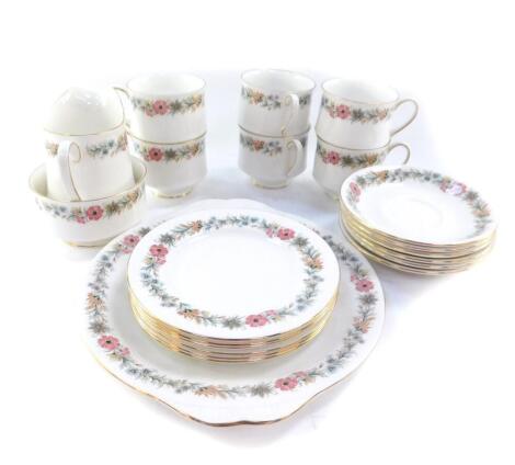 A Paragon porcelain part tea service decorated in the Belinda pattern, comprising bread plate, cream jug, sugar bowl, six teacups, sauces and plates.