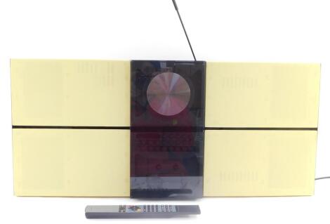 A Bang and Olufsen BeoSound Century system, circa 1993, type number 2652, serial number 14963176, with remote and instruction booklets.