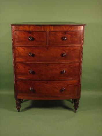 An Victorian mahogany bow front chest of two short and three long drawers