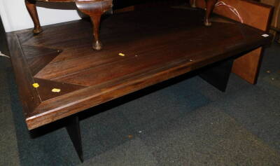 A dark wood coffee table with a steel twin pedestal base, 40cm high, 120cm wide, 70cm deep.