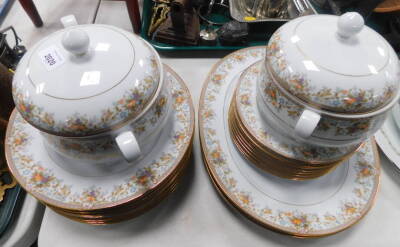 A Noritake porcelain part dinner service decorated in the Harvesting pattern, No 2770, comprising a pair of meat platters, pair of vegetable tureens and covers, eight dinner and dessert plates. Auctioneer Note: We have specific vendor instructions to sell