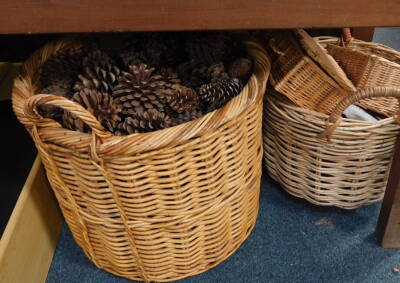 A large wicker log basket, containing a quantity of pine cones, various other wicker baskets, etc. (a quantity)