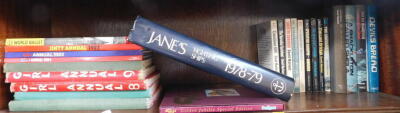 Children's annuals, to include Girl Annual 1983., Goal Book World Ballet., Ginty Annual 1983., together with various paperbacks, Slipcase Giles Golden Jubilee special edition book., Giles Jane's Fighting Ships 1978-79, etc. (1 shelf)