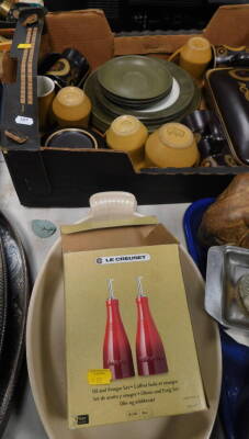 Two large Le Creuset casserole dishes, boxed vintage Le Creuset vinegar bottles, other kitchenalia, Denby and other similar kitchen ware. (1 box plus)