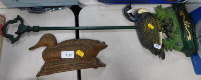 A modern metal duck boot scraper, and another, 69cm high. (2)