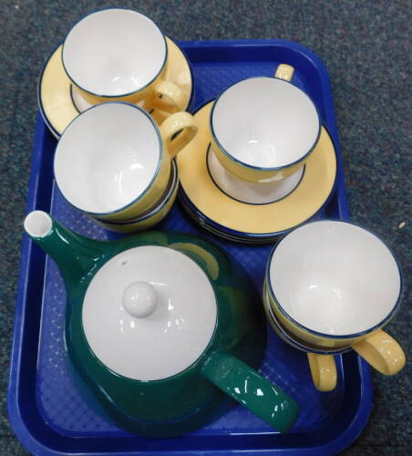 Six Pagnossin Italy tea cups and saucers, in the Treviso design, yellow with dark blue trim, together with a Pagnossin Italy teapot, green with white trim. (AF, small chip to teapot lid).