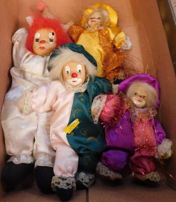 Four vintage models of clowns, various sizes, variously attired.