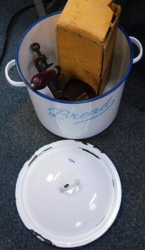 An enamel bread bin, marmalade cutter, and a kitchen rack.