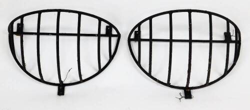 Two cast metal wall mounted hay racks, 50cm wide, 22cm deep.