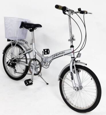 A Urbanisi Viking folding bicycle, with a white basket.