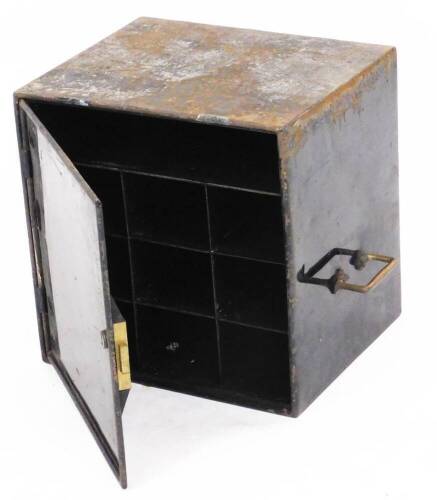 An early 20thC metal letter safe, with black painted finish opening to reveal shelf and nine box section, with brass carrying handles, 39cm high, 38cm wide, 31cm deep.