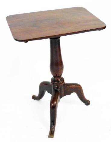 An early 19thC mahogany tripod table, the rectangular panelled top on a baluster tripod base, 70cm high, 55cm wide, 43cm deep.