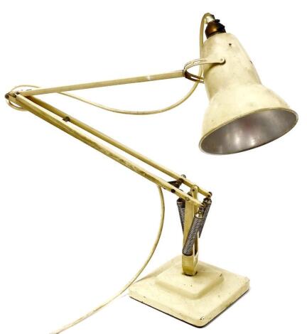 A Herbert Terry & Co cream painted anglepoise lamp, extending to a full height of 96cm.