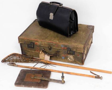 A canvas travel trunk, Victorian bamboo grab picker, lacrosse racket, briefcase, and winding mechanism. (5)