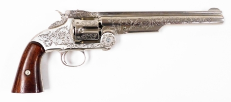 A fine replica of the Colt .44 calibre Revolver, numbered 20029, with mahogany handle. A copy of the Wyatt Earp OK Corral gunfight Peacemaker, 34cm long.