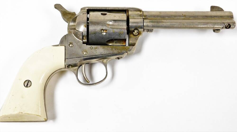 A replica Wild West revolver, stamped Cal. .44 to .40 Long