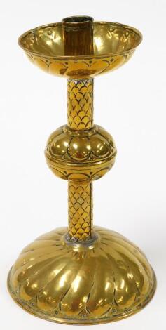 An early 20thC brass candle stand, weighted base 26cm high.