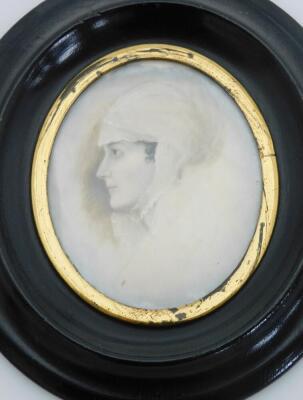 An early 19thC portrait miniature, depicting a maiden in headdress, painted on ivory, 5.5cm x 5cm, in a gilt surround, in a black oval frame, with numbering to paper back 130P, 12cm x 10cm. - 2