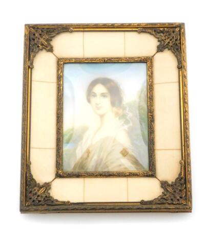 An early 19thC portrait miniature of a lady, the half length portrait of lady in white evening dress with applied golden jewellery and crucifix, with rose decoration by a lake, bears signature Sui C ?, 8cm x 6cm, in a ornate frame with ivorine type rectan