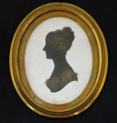 A 19thC silhouette lady, facing sinister, of oval form, quarter profile, finely dressed, hand written to the back Jane Sarah Wightwick 1821, on plaster and ebonised frame, 8cm x 7cm, a similar portrait of a gentleman facing dexter 1821, and another. (3) - 6