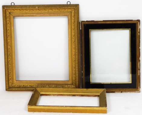 Three gilt framed picture frames.