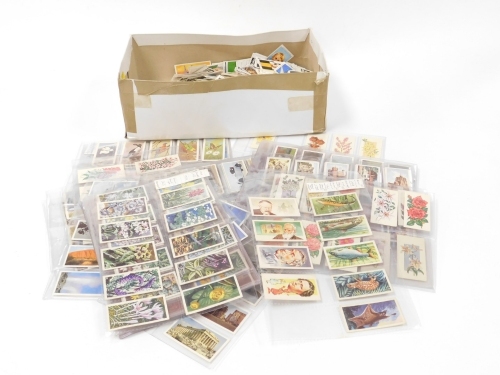 A group of tea and trade cards, to include Sun soccer cards, wildlife, trains, etc. (2 boxes)