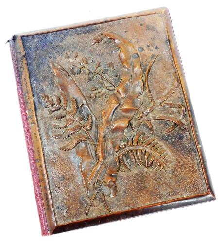 A mid 19thC blotter pad, with a wooden cover having carved foliage designs and inscribed received by Augusta Pearson 1858 for G A K Howman, December 16, and with red Morocco leather binding to the reverse and spine, 31cm x 25cm.