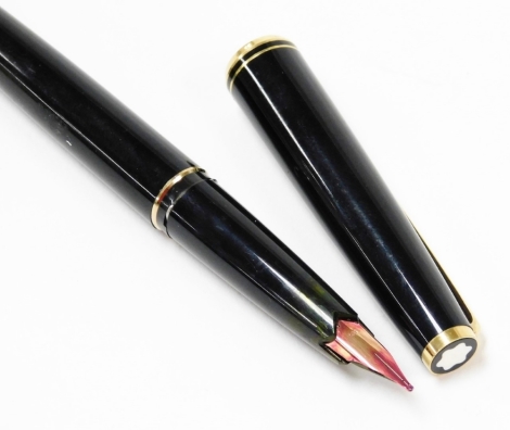 A Montblanc No. 22 fountain pen, in black with gold plated mounts, the nib stamped 585.