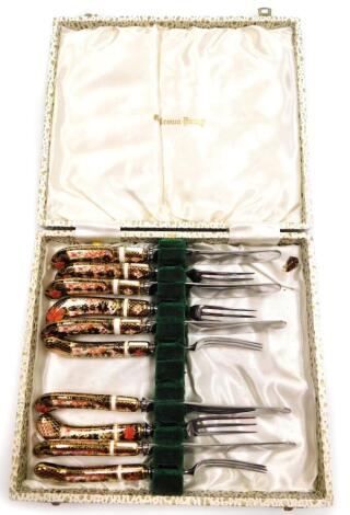 A cased set of five pairs of Royal Crown Derby Imari pattern tea knives and forks, with pistol handles.